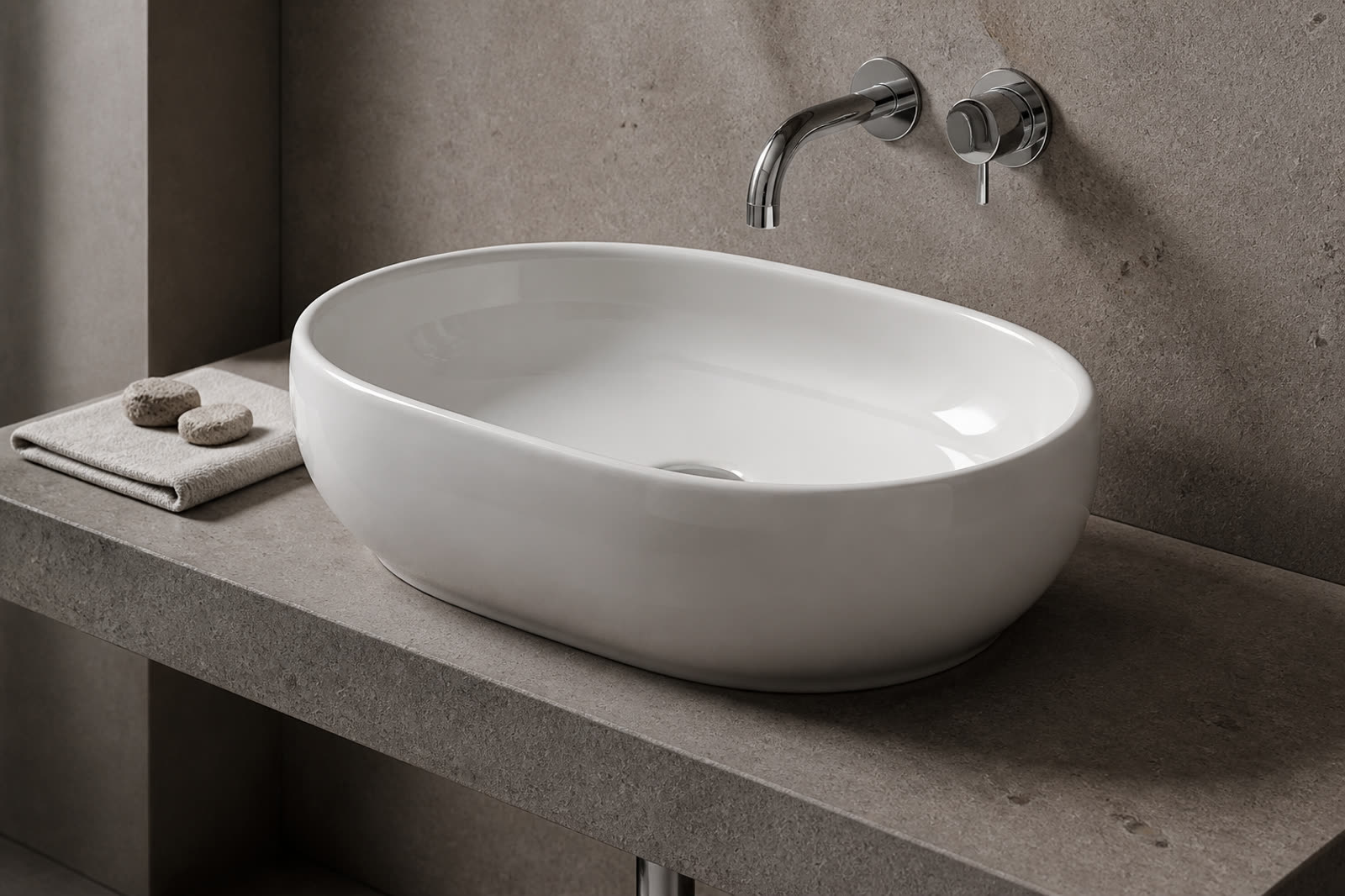 Lavatório cerâmico branco sobre pedra taupe, com misturadora de parede cromada